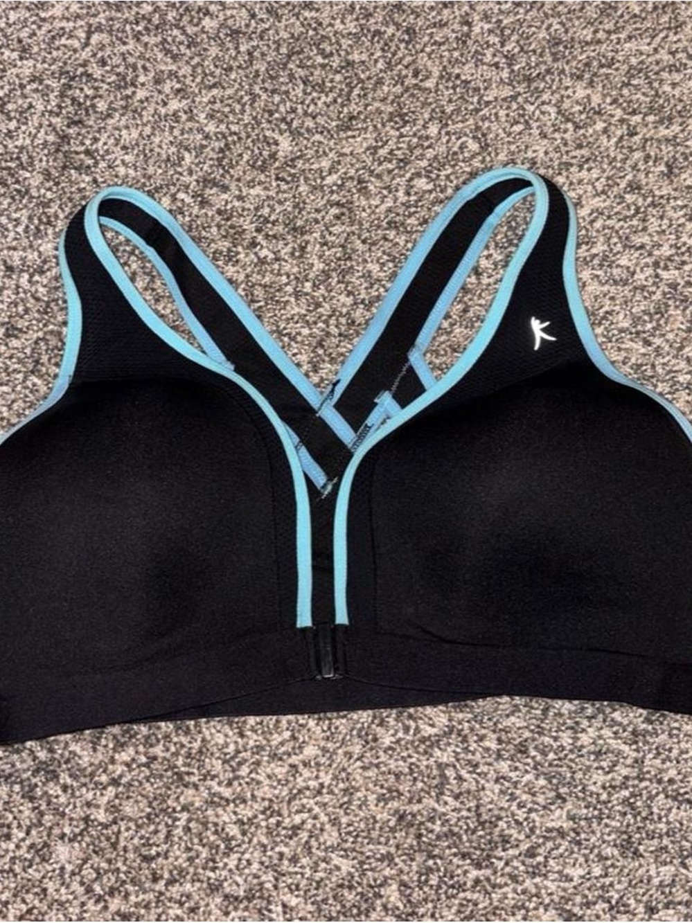 Danskin black sports bra with light blue trim, size 38C